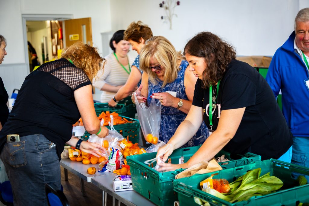 Volunteers sorting and organizing food donations