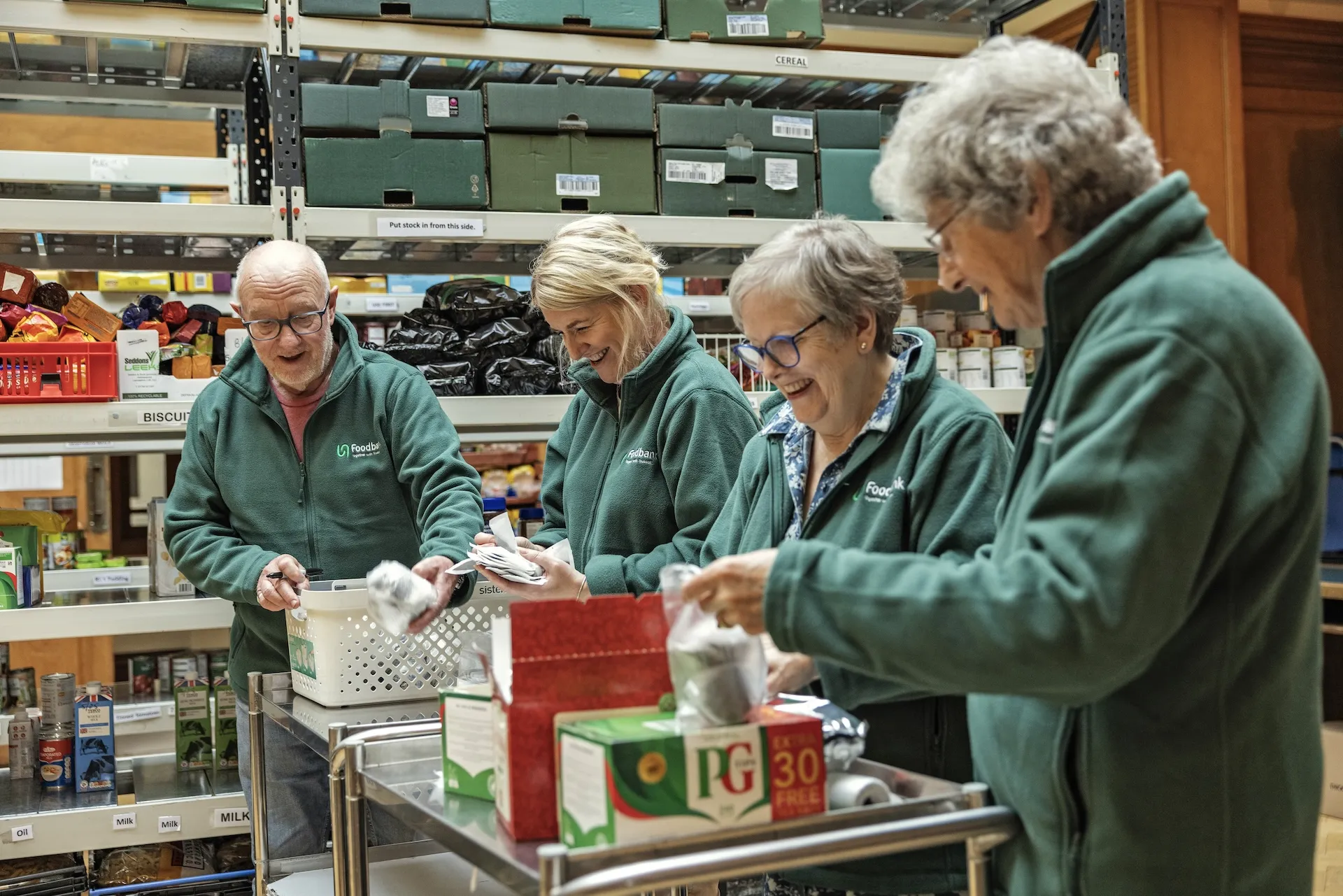 Volunteers sorting donated food items